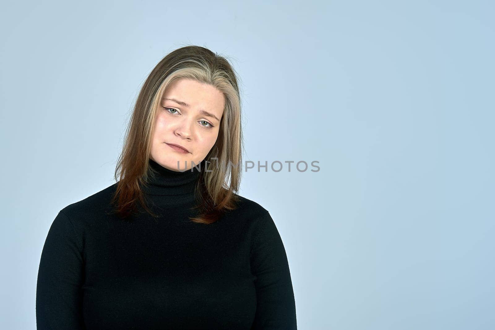 a very sad woman in the background in a black turtleneck. High quality photo