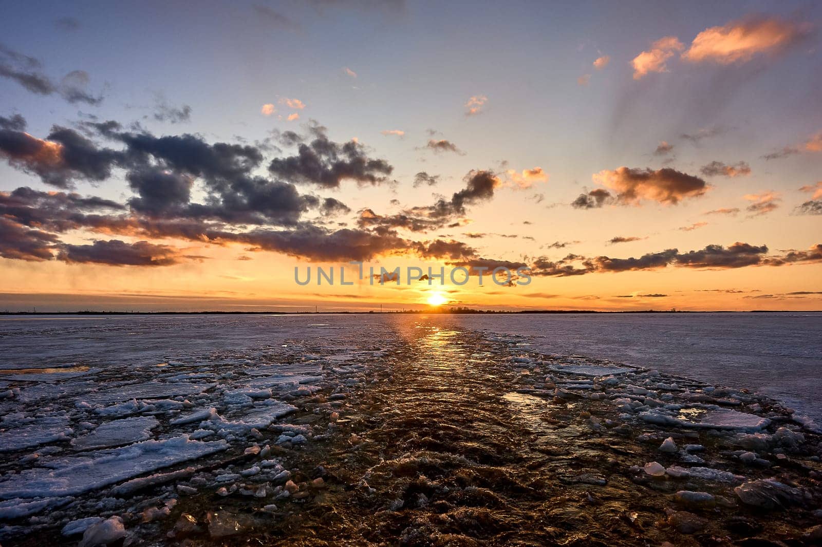 Sunset over the river in the ice. High quality photo