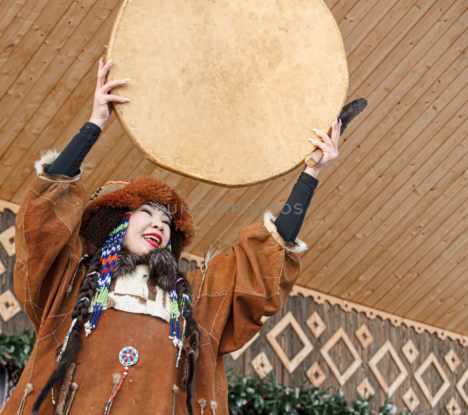 PETROPAVLOVSK, KAMCHATKA, RUSSIA - DECEMBER 24, 2021: Folk ensemble performance in dress of indigenous people of Kamchatka. The holiday Northern aboriginal Koryak
