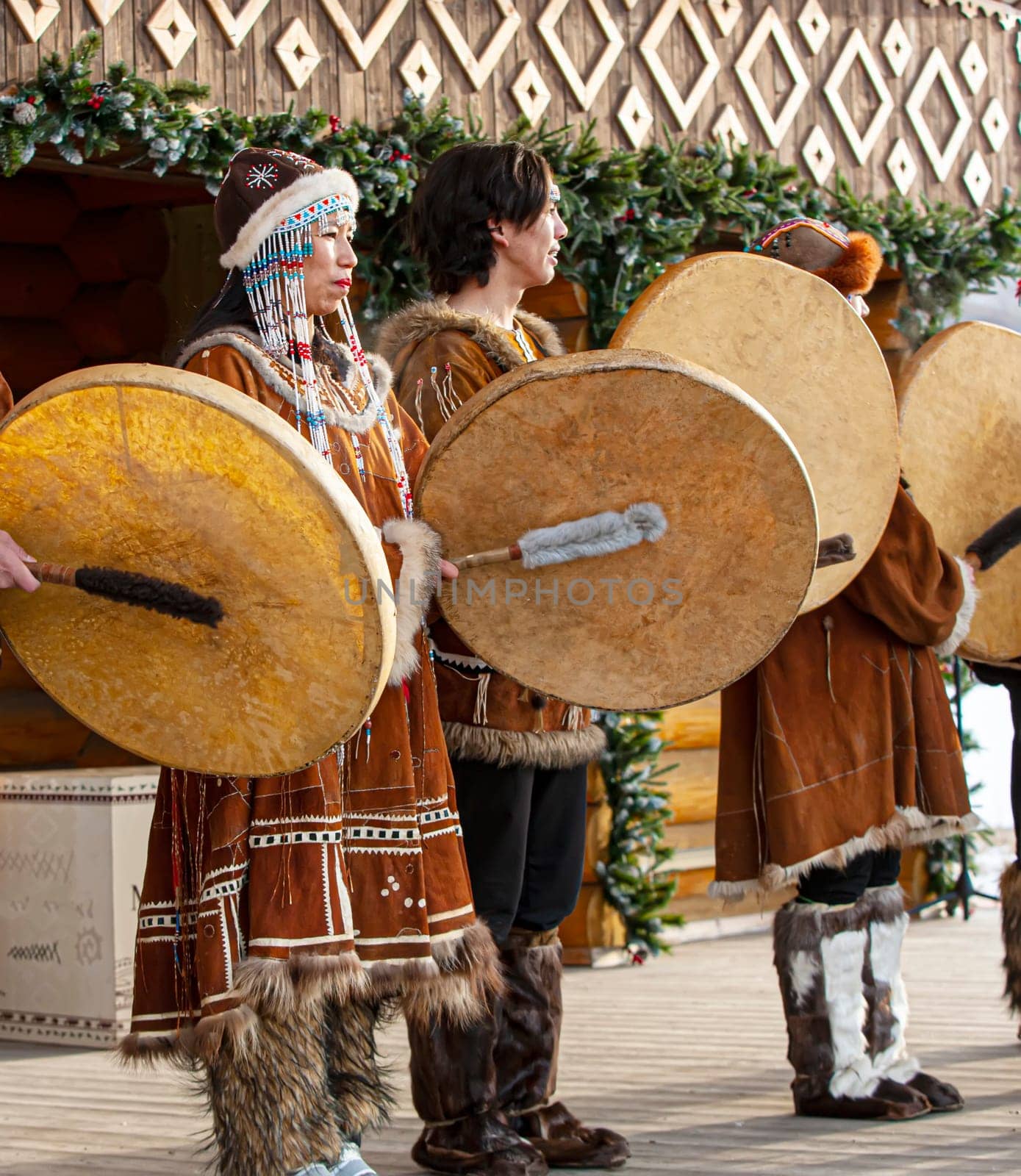 KAMCHATKA, RUSSIA - DECEMBER 24, 2021: Folk ensemble performance in dress of indigenous people of Kamchatka. The holiday Northern aboriginal Koryak