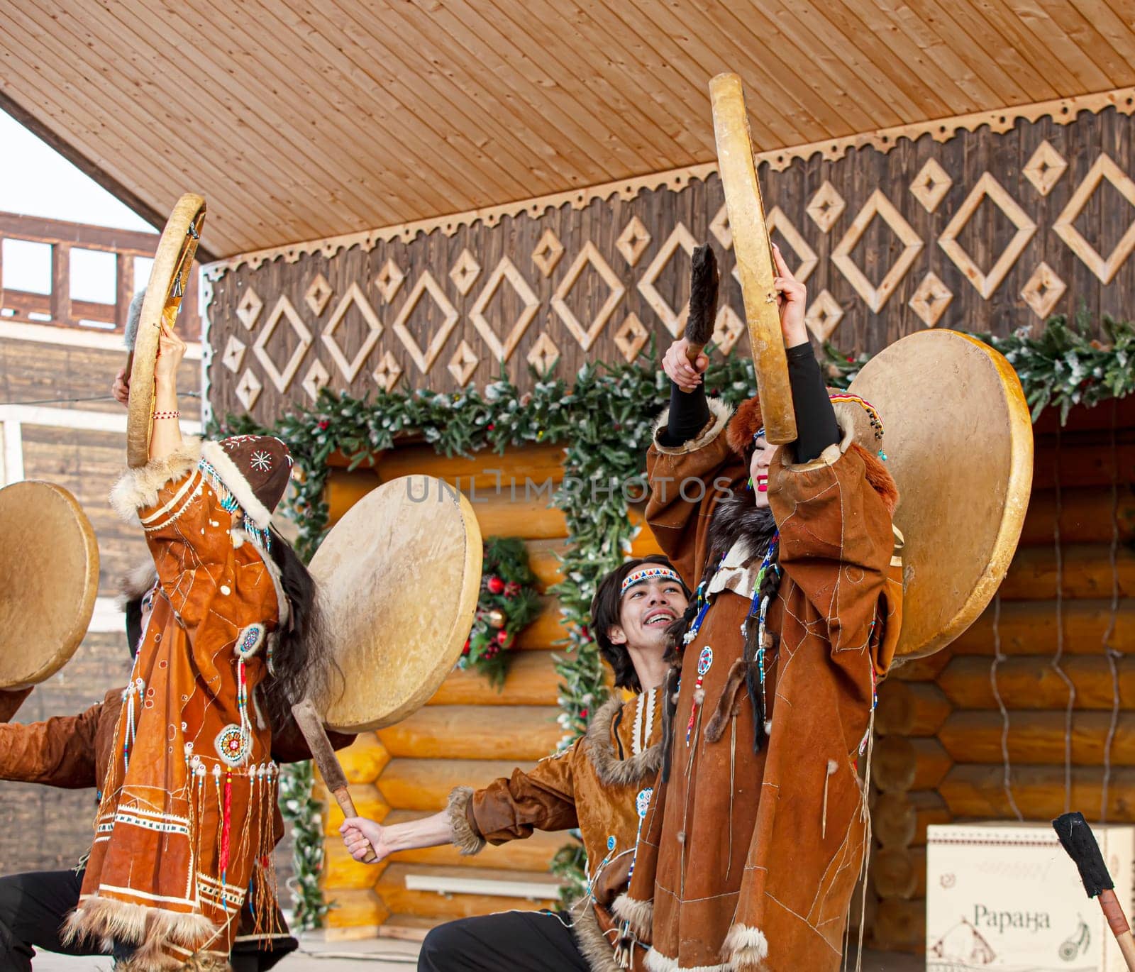 PETROPAVLOVSK, KAMCHATKA, RUSSIA - DECEMBER 24, 2021: Folk ensemble performance in dress of indigenous people of Kamchatka. The holiday Northern aboriginal Koryak