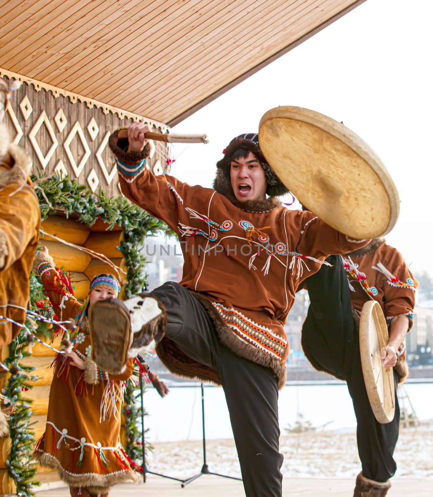 KAMCHATKA, RUSSIA - DECEMBER 24, 2021: Folk ensemble performance in dress of indigenous people of Kamchatka.