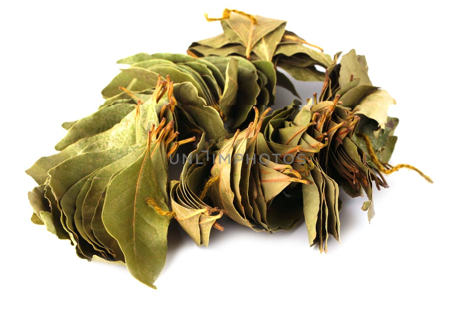 The pile of dry  bay leaves isolated on white background