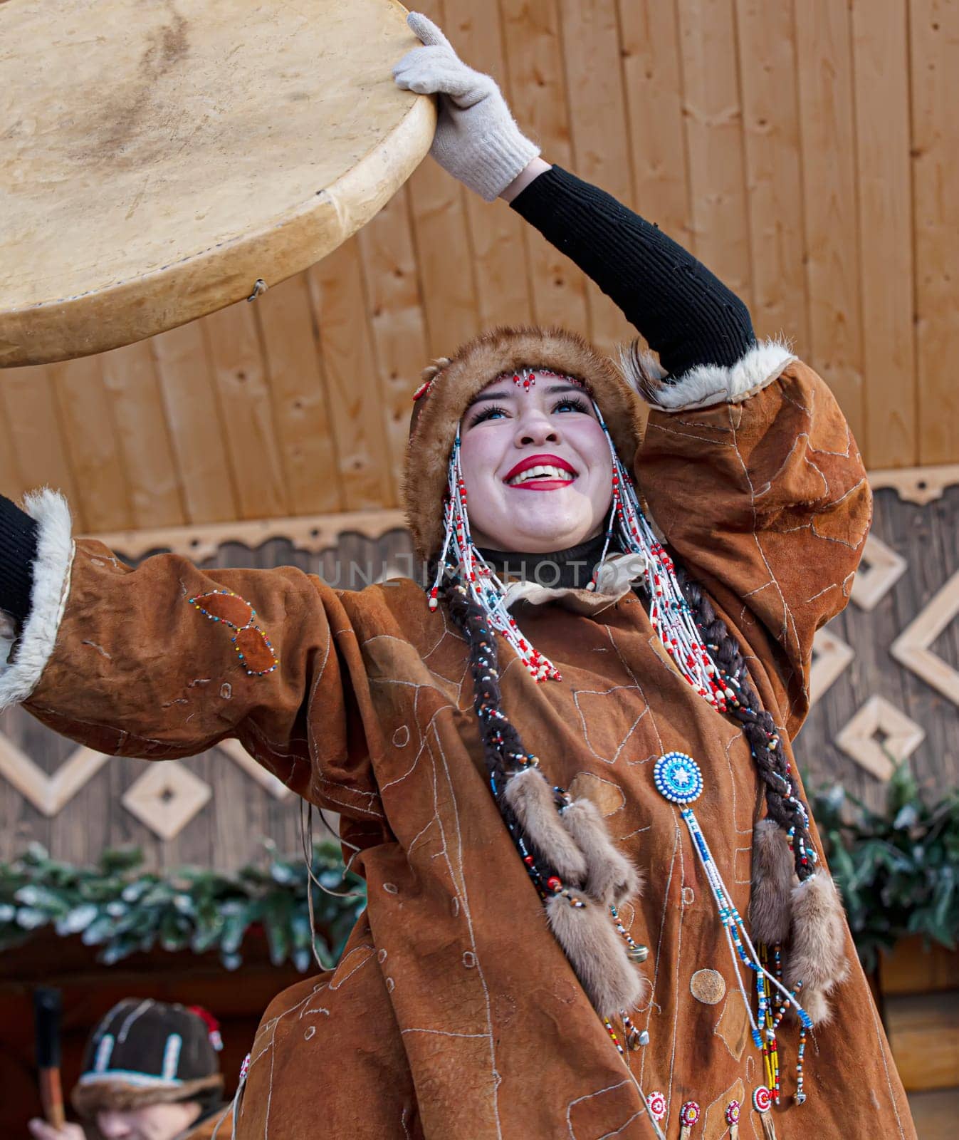 PETROPAVLOVSK, KAMCHATKA, RUSSIA - DECEMBER 24, 2021: Folk ensemble performance in dress of indigenous people of Kamchatka. The holiday Northern aboriginal Koryak