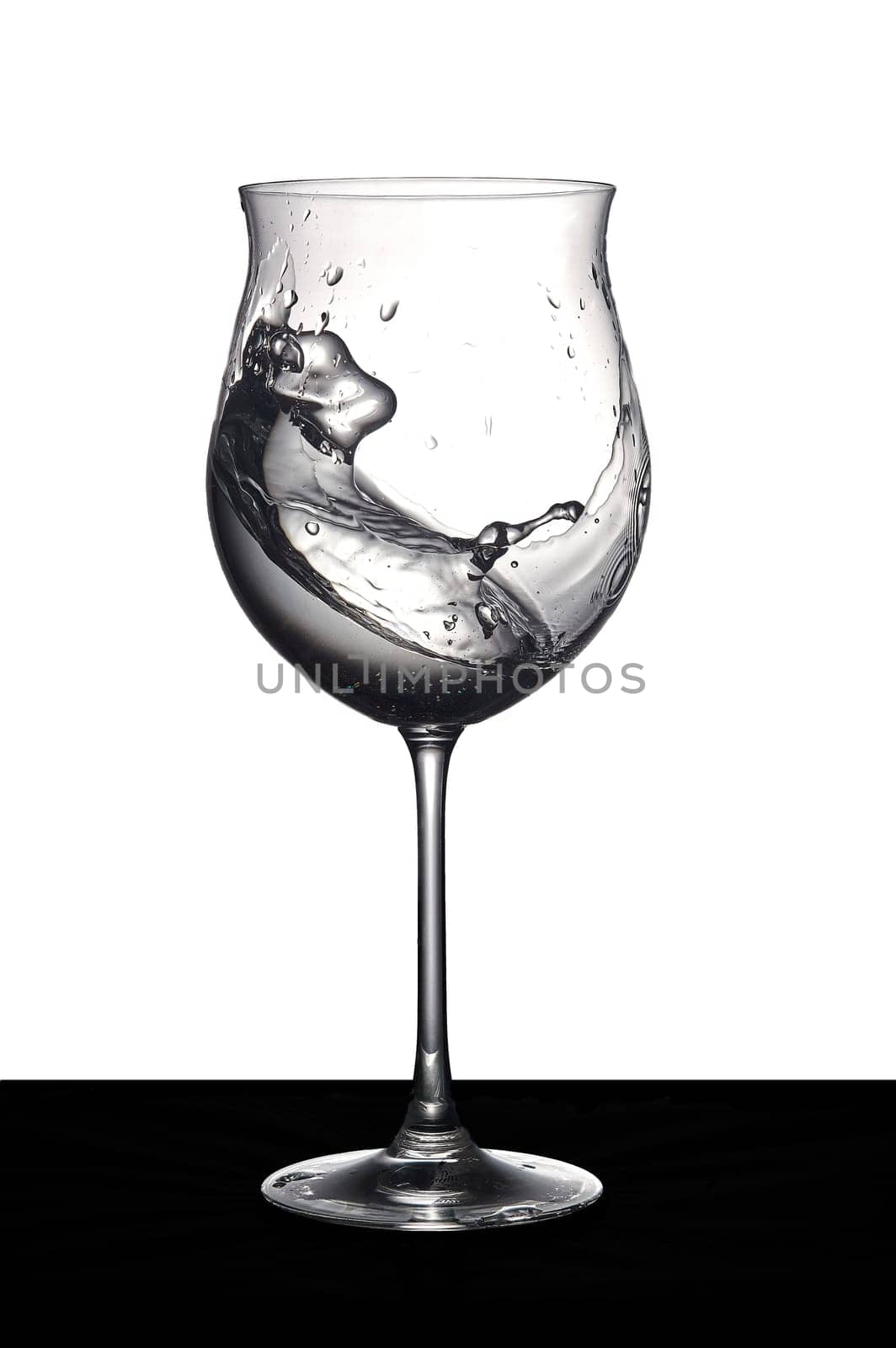 Shaken water in a glass. High quality photo