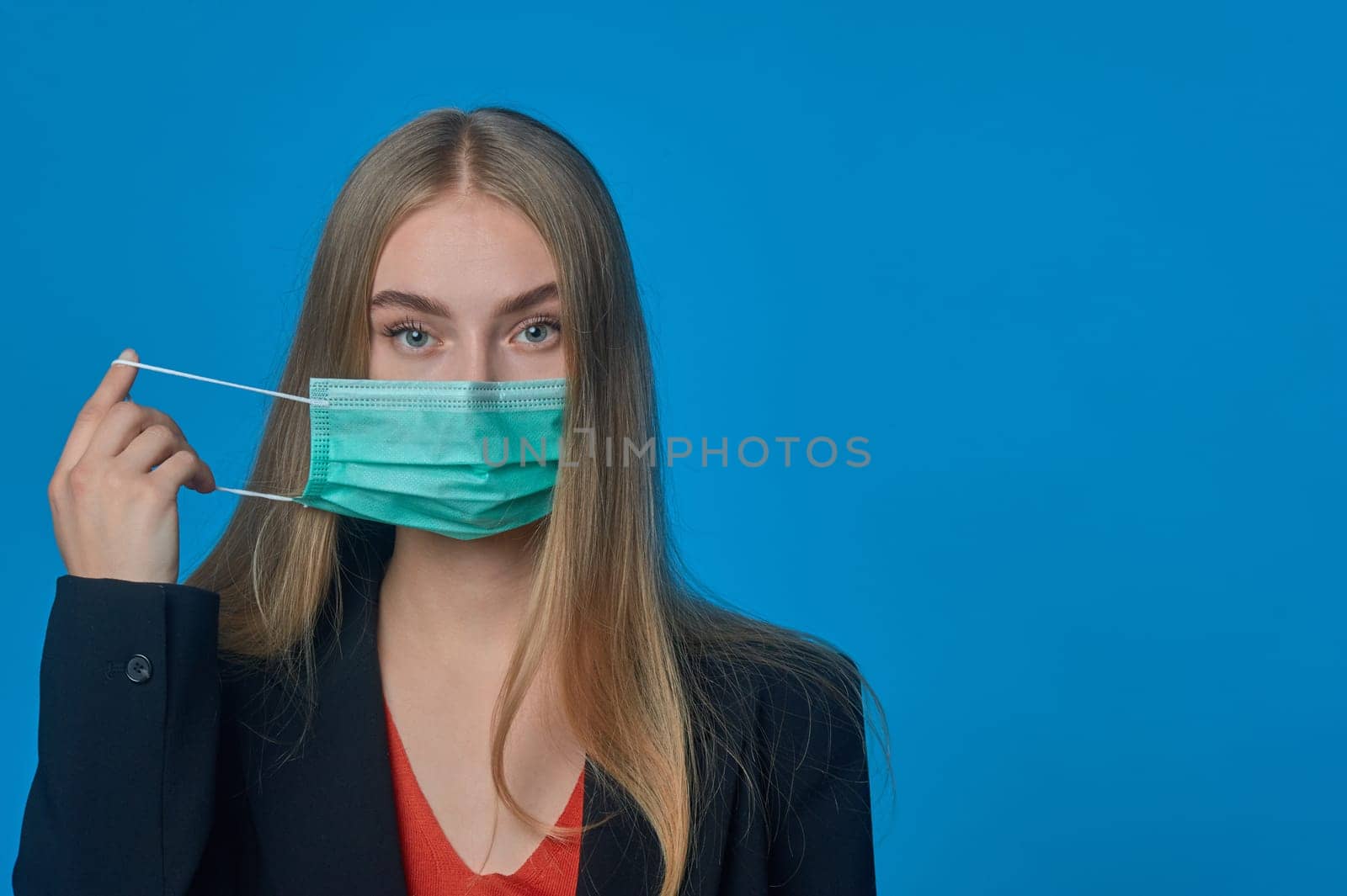 girl with a medical mask on her . High quality photo
