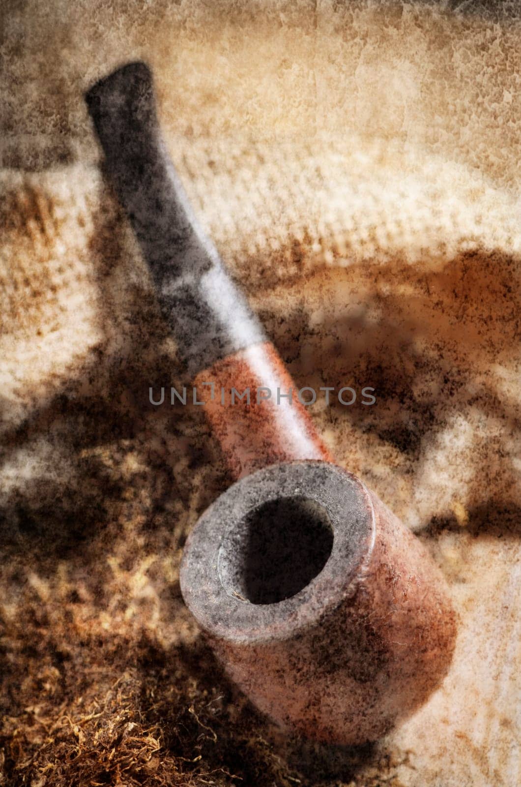 Vintage image of tobacco pipe on wooden background