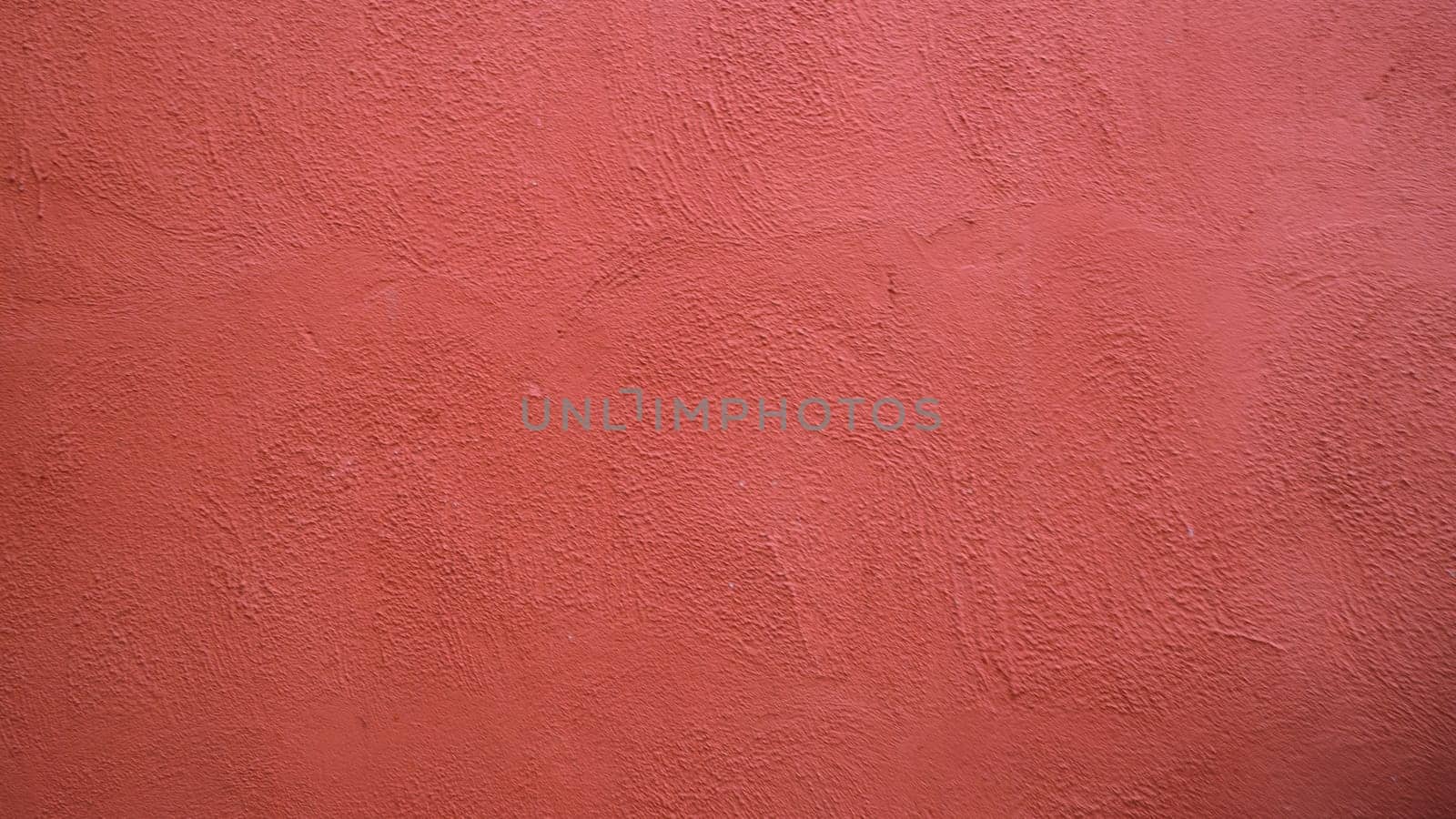 Abstract background from  red stucco concrete wall with sunlight, light and shadow