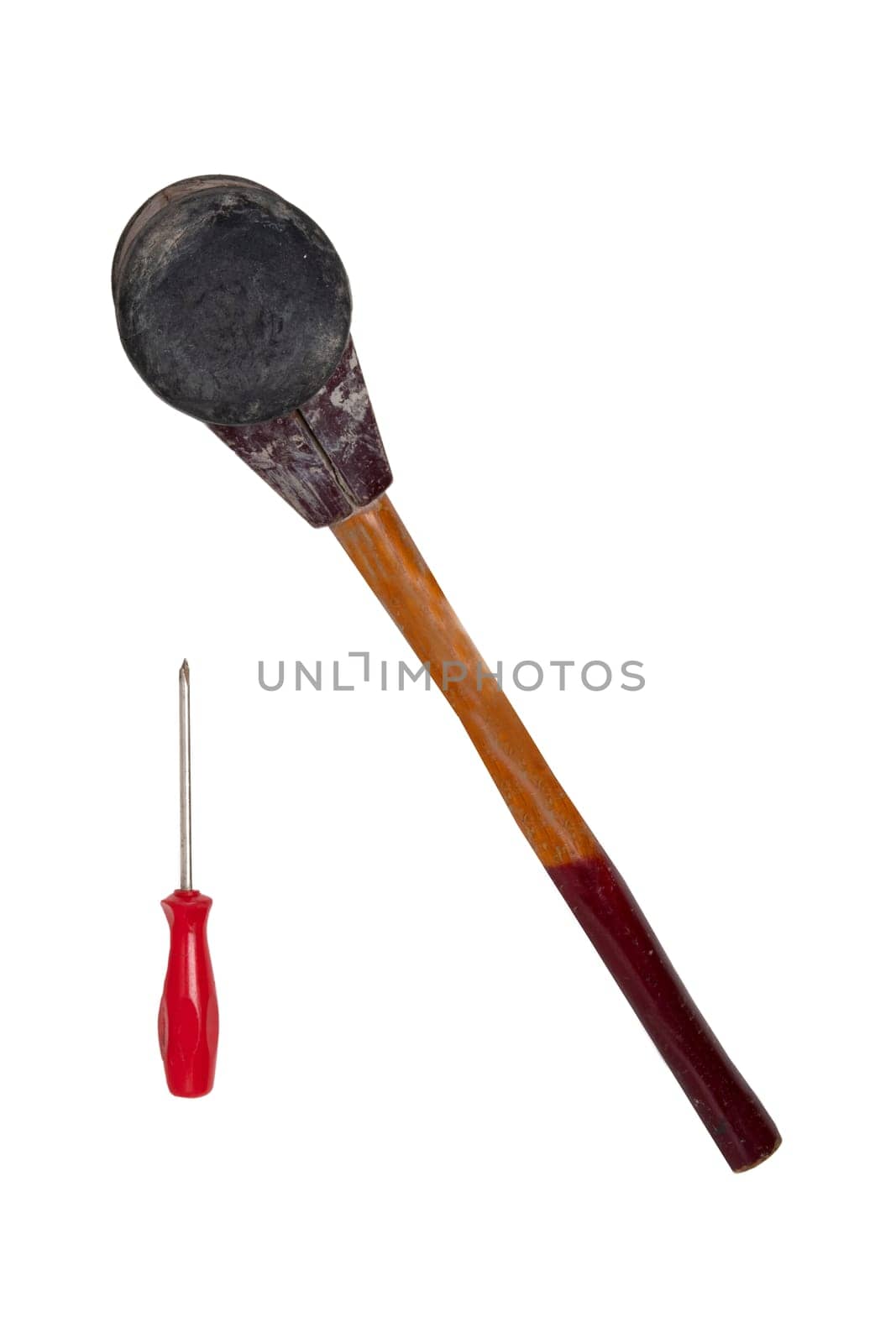 Size comparison between a professional paving hammer and a screwdriver isolated on a white background. A bricklayers equipment for laying paving stones. Craftsman tools.