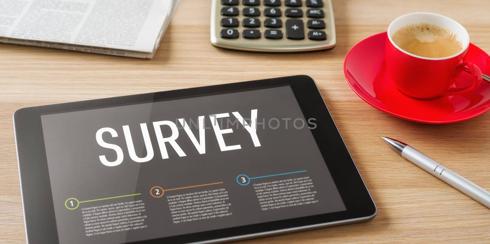 A tablet on a desk with the headline Survey