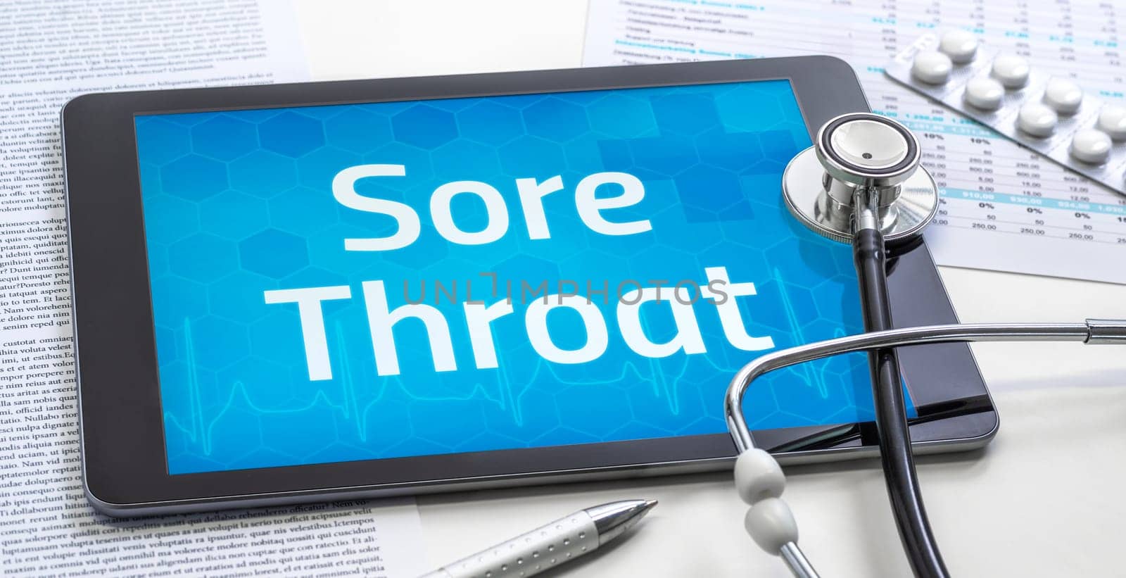 The word Sore Throat on the display of a tablet
