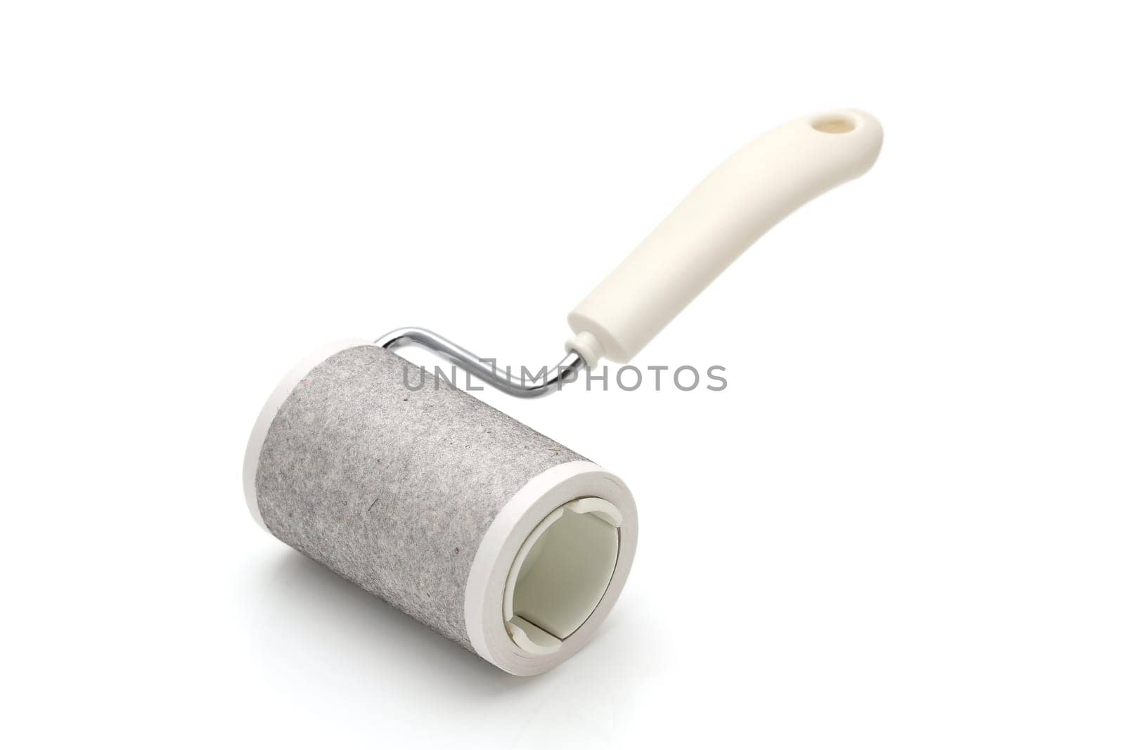 close up of used sticky roller cleaning, housework and housekeeping concept