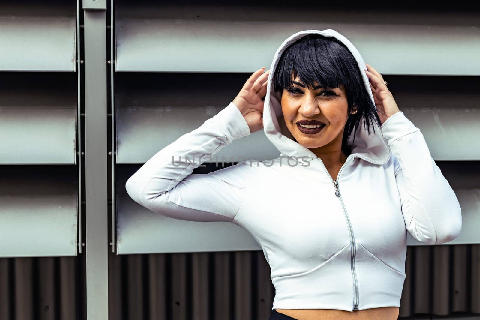 Young cute black hair woman posing with stylish Hoodie