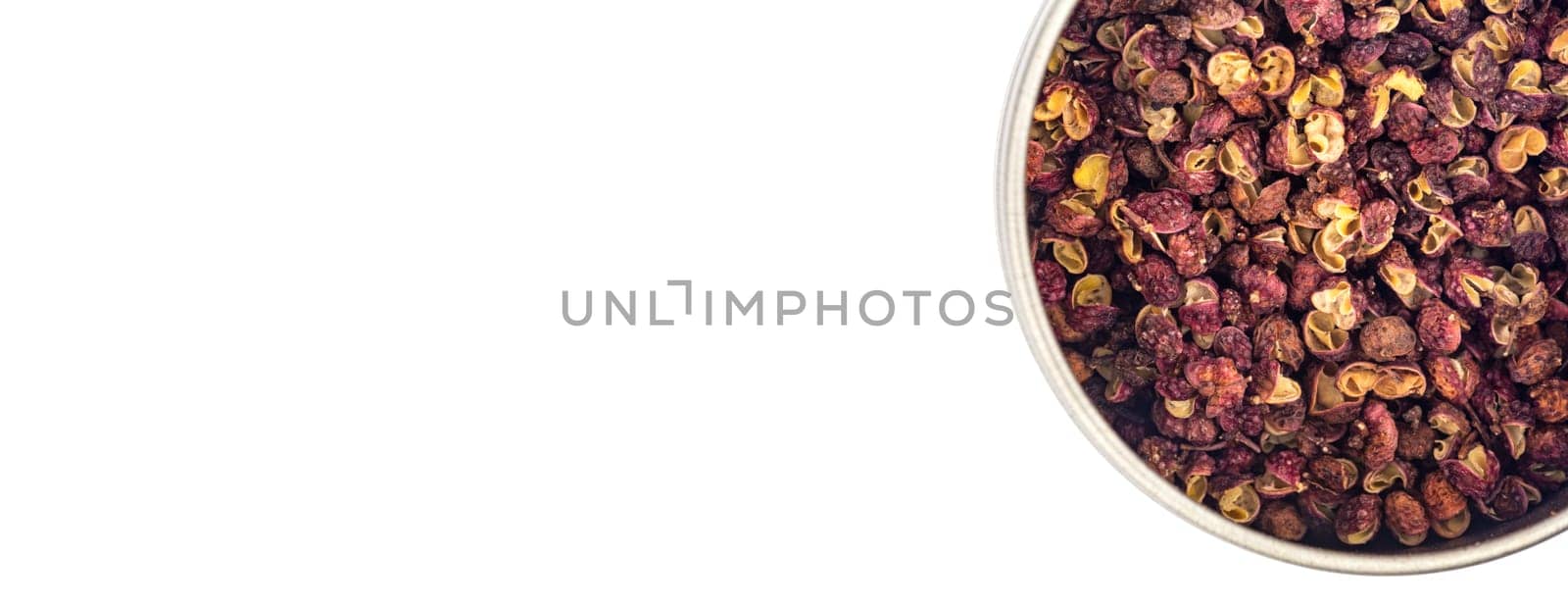 Szechuan pepper in a bowl isolated over white background