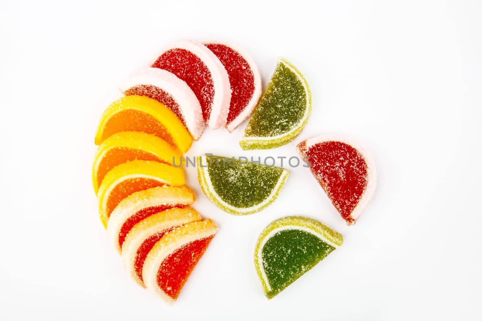 Colourful jelly fruit isolated over white background