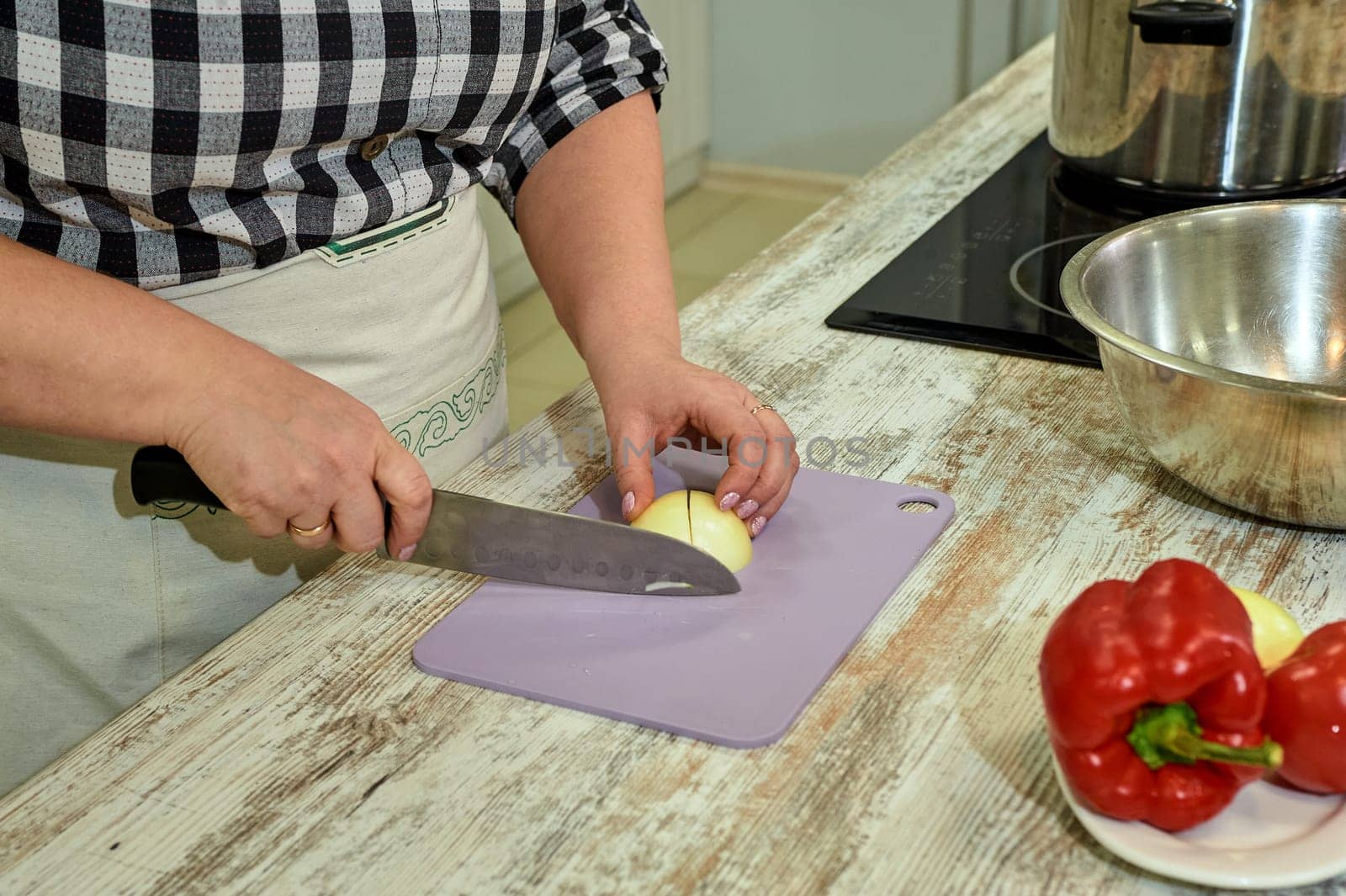 Cutting onions when cooking on a Board. High quality photo