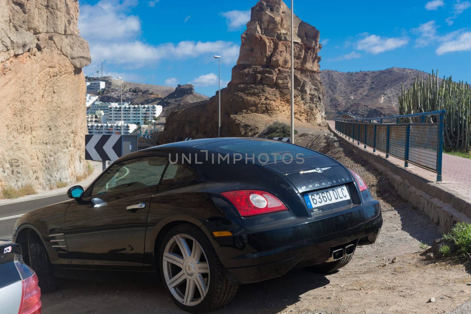 CRAN CANARIA, PUERTO RICO - NOVEMBER 16, 2019:.Chrysler Crossfire Coupe in a parking lot above the marina in Puerto Rico on Gran Canaria.