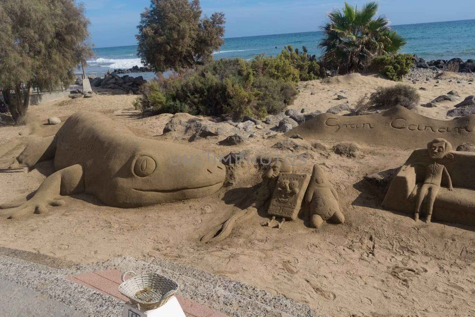 CRAN CANARIA, MELONERAS - 13. NOVEMBER 2019:.Sand sculptures on the beach of Meloneras, Spain with inscription Gran Canaria