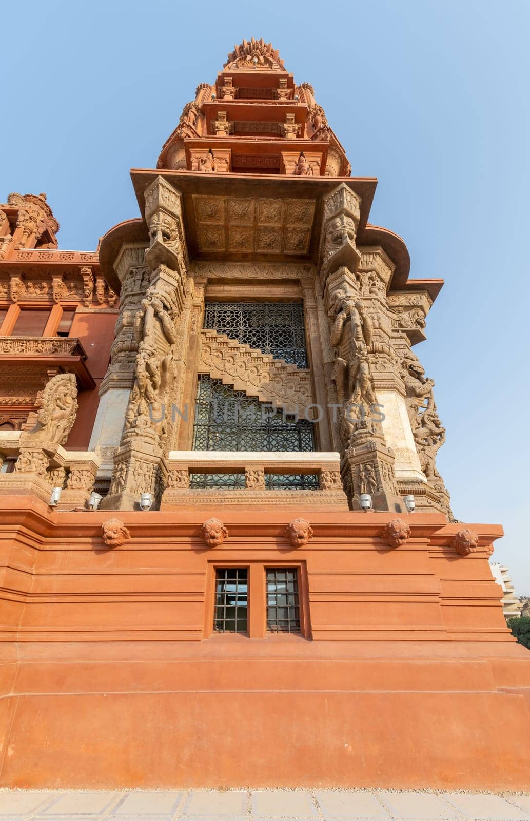 Low angle of the tower of Baron Empain Palace, a historic mansion inspired by the Cambodian Hindu temple of Angkor Wat, located in Heliopolis district, Cairo, Egypt