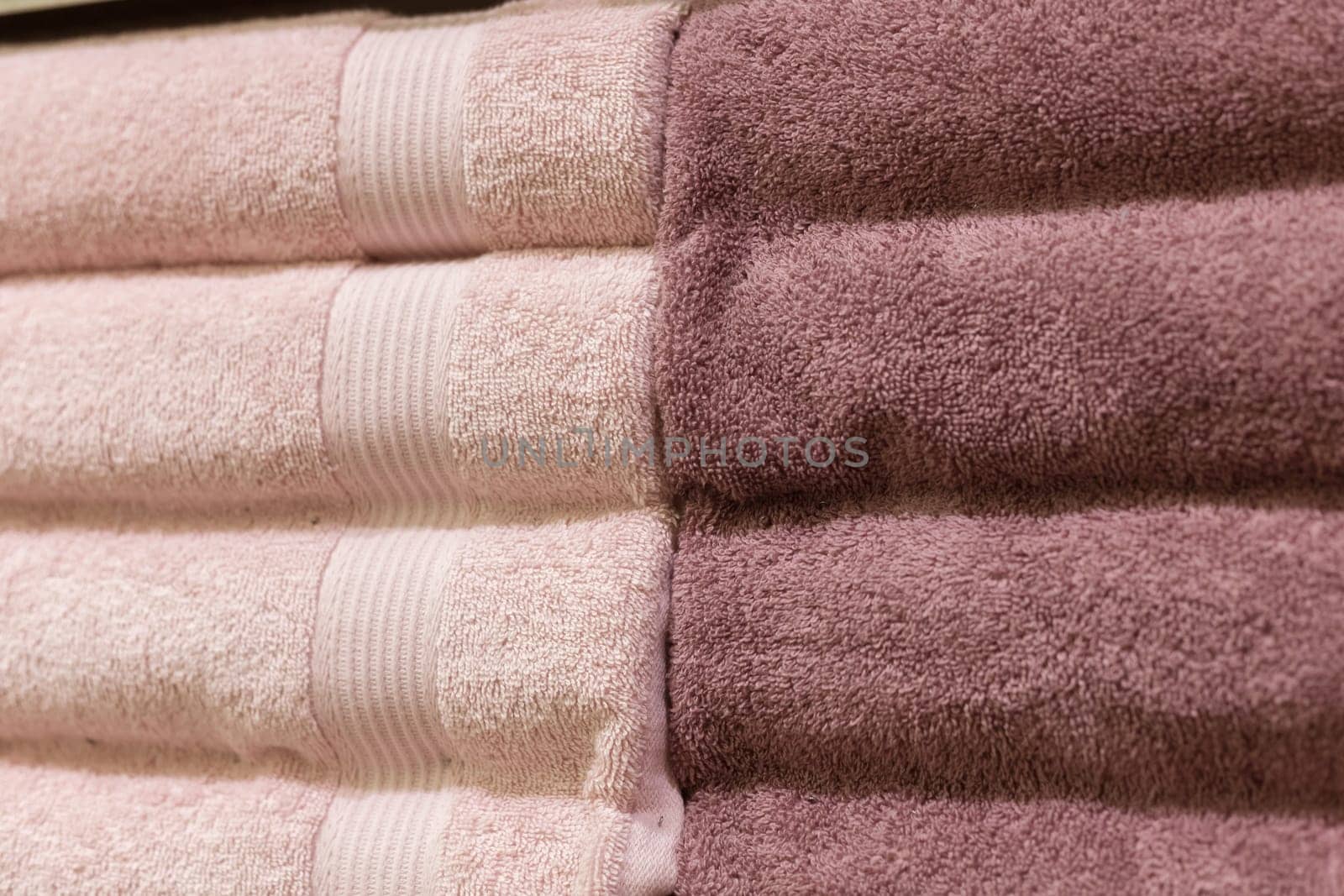 Stack of fluffy towels in store. Background.
