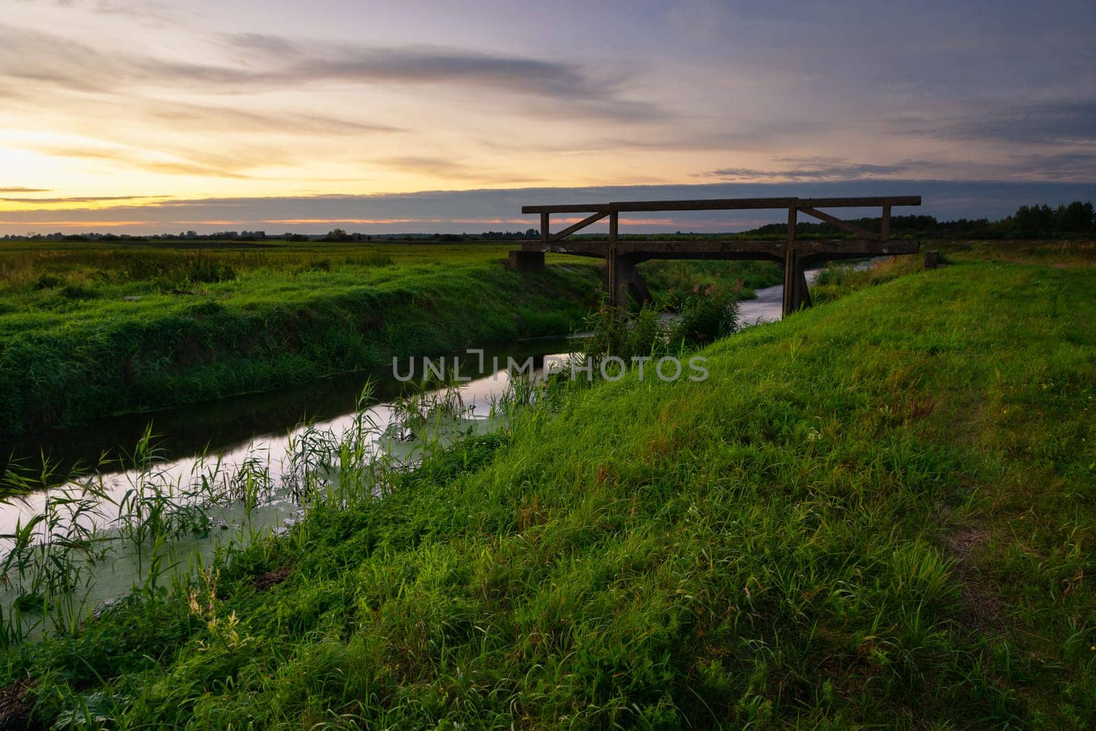 Concrete bridge over the Uherka river in eastern Poland, evening view