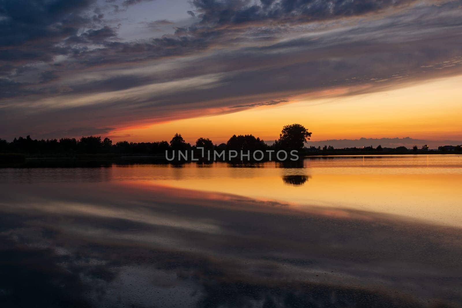 Reflection of clouds in the water after sunset, Stankow, Lubelskie, Poland