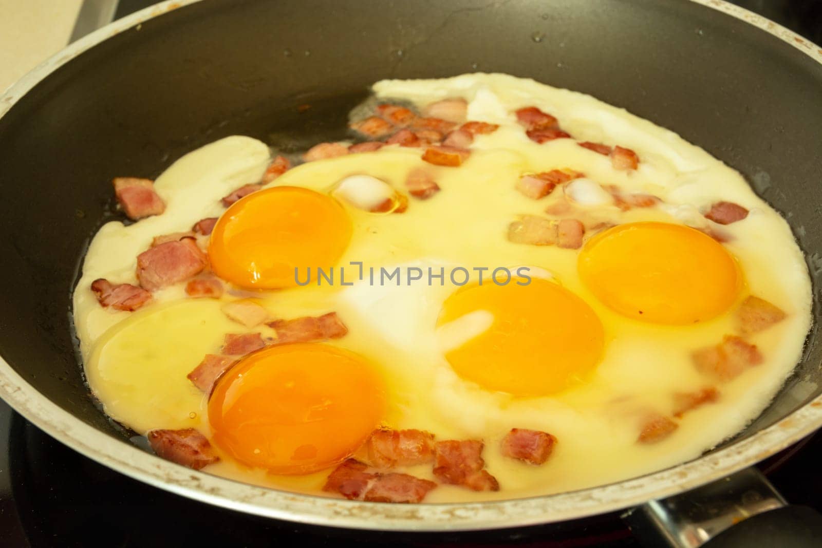 Fresh fried eggs with bacon in the pan