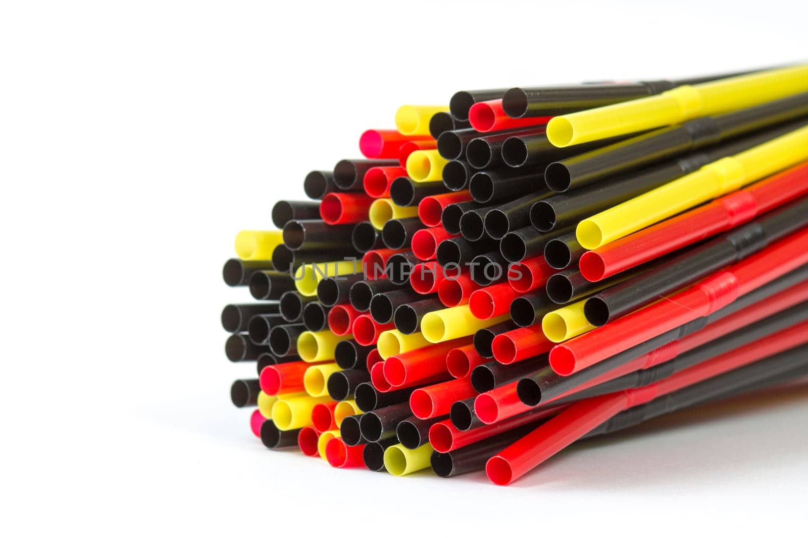 Colorful drinking straws on white background