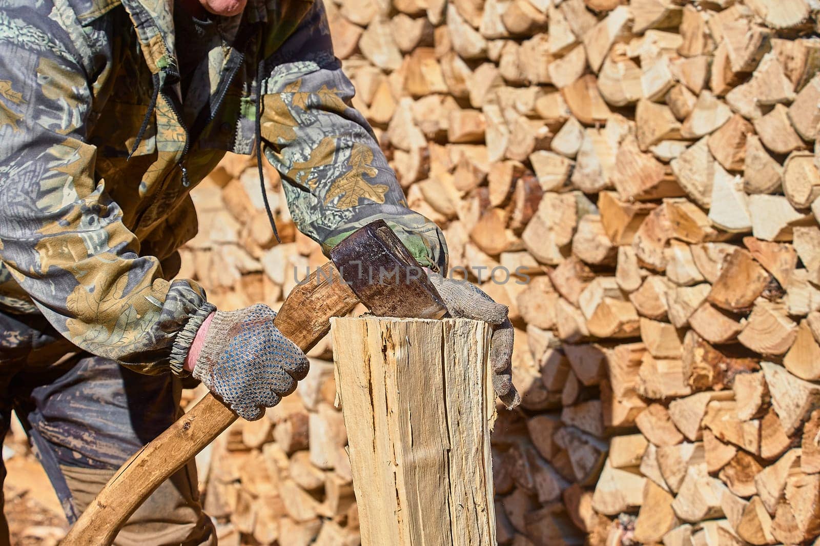 chopping firewood with a chopper close-up on a sunny day. High quality photo
