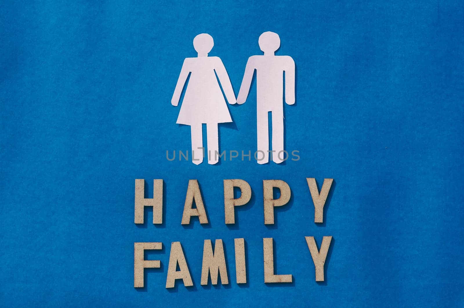 Happy Human Couple Paper Craft Mockup on Blue background. Origami Papercraft decorative shapes and figures. Happy Family Concept.
