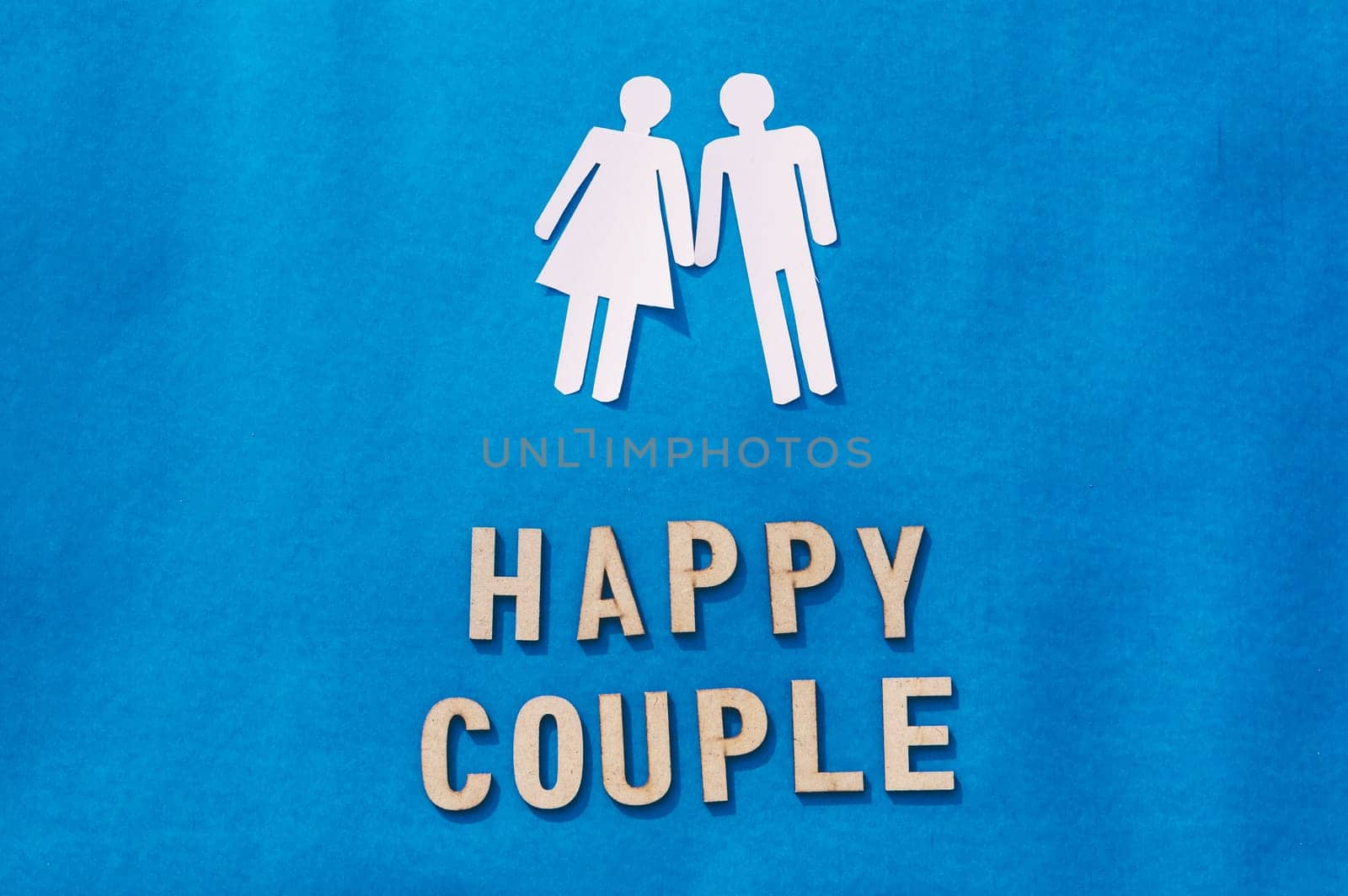 Happy Human Couple Paper Craft Mockup on Blue background. Origami Papercraft decorative shapes and figures. Vertical.