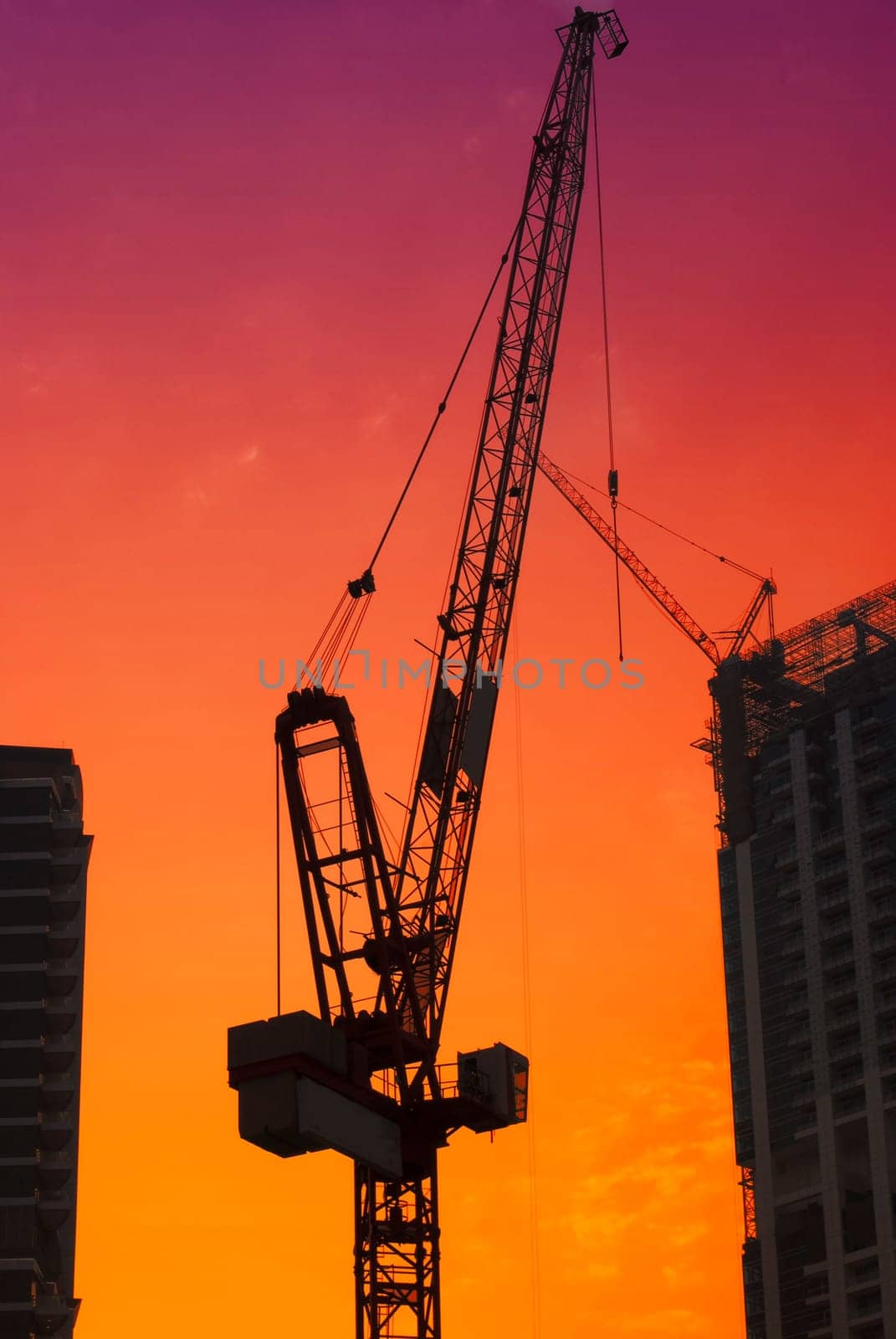 Construction site in Dubai with red sky