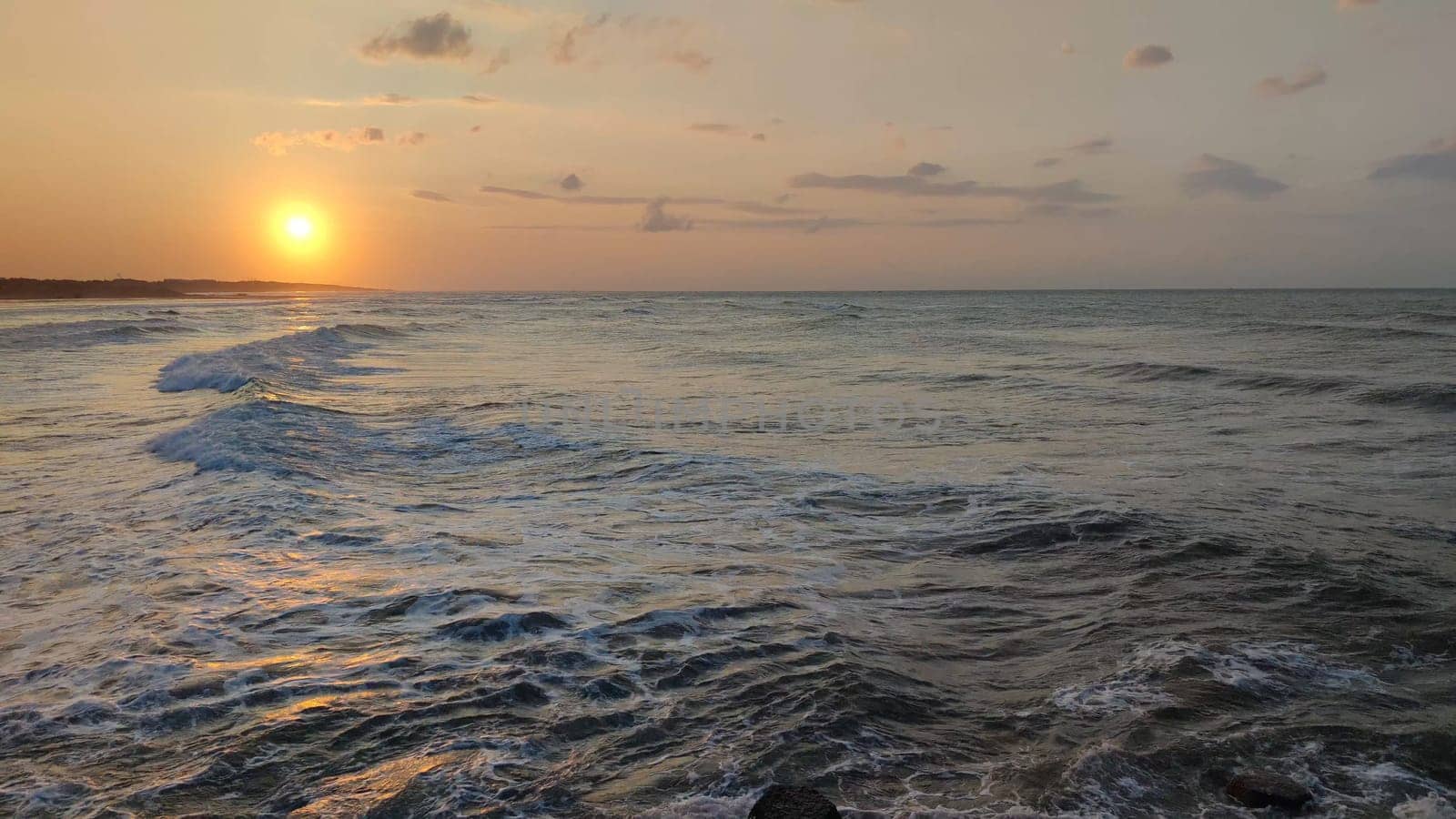 Sea sunset,sea landscape,sea water surface lit by sunset summer light