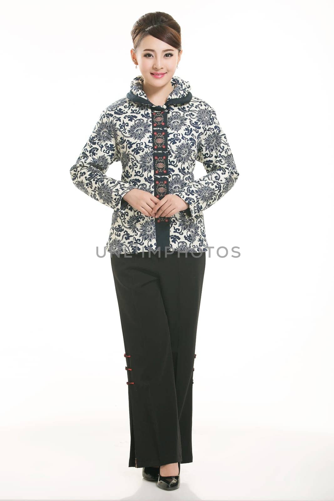 Wearing Chinese clothing waiter in front of a white background