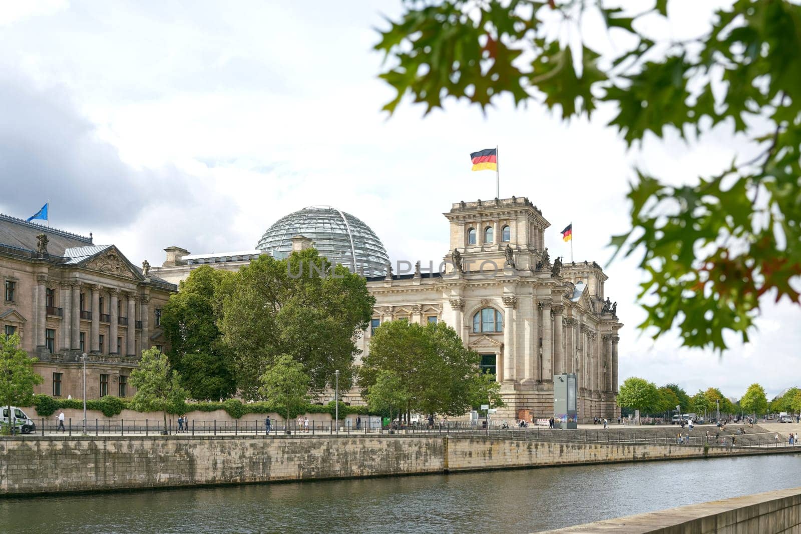 The Reichstag in Berlin on the banks of the Spree River. The Reichstag is the seat of the German Bundestag.