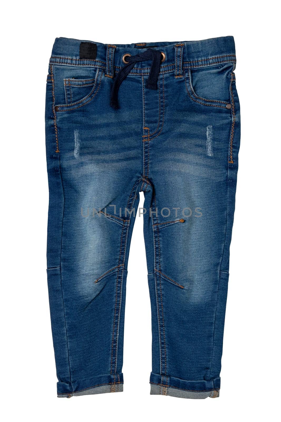 Blue jeans isolated. Closeup of a trendy stylish dark blue denim pants or trousers for boys isolated on a white background. Kids summer and autumn fashion. Front view.