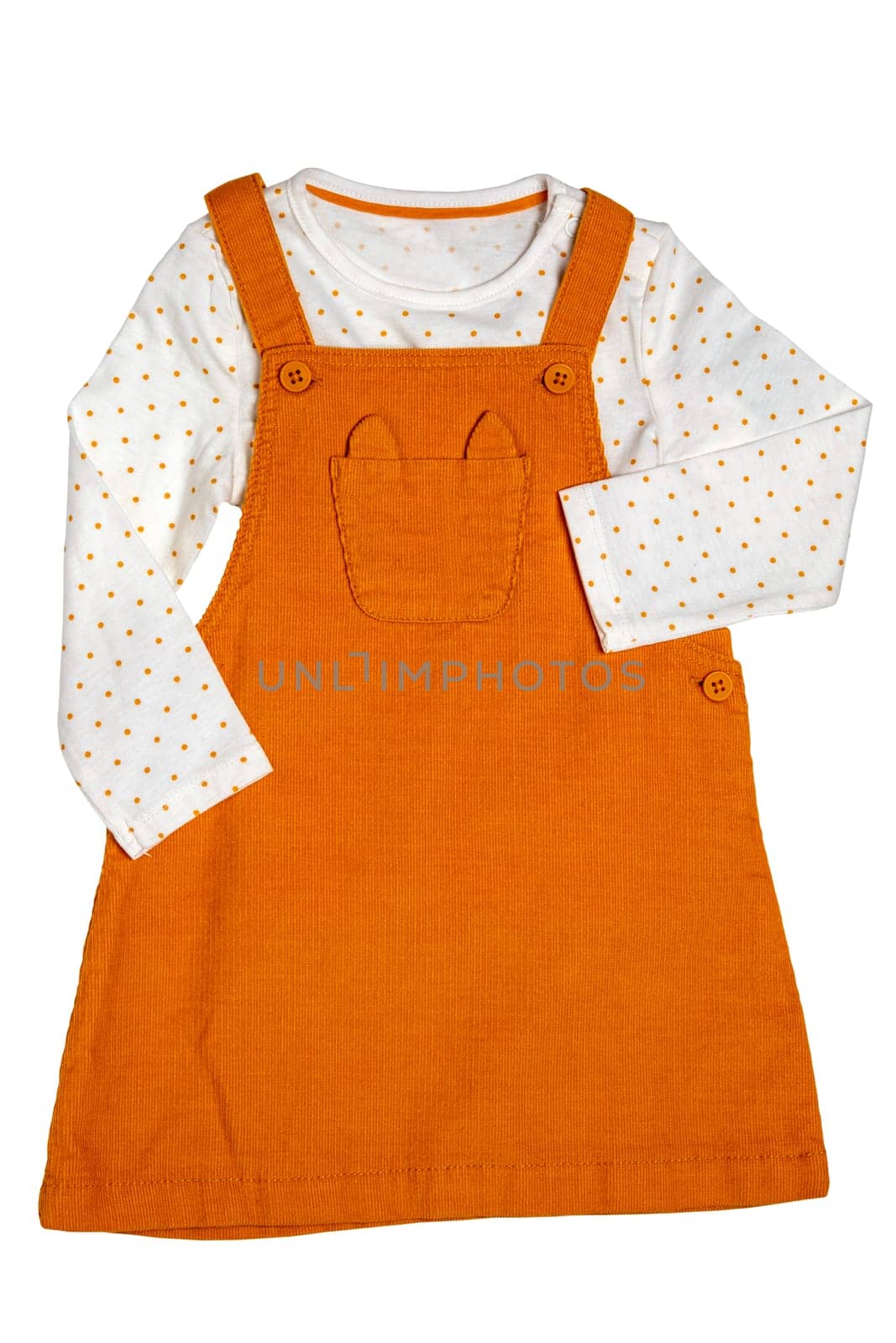 Summer dress isolated. Closeup of a beautiful orange baby girl dress and a white shirt with yellow polka dots isolated on a white background. Children spring fashion.