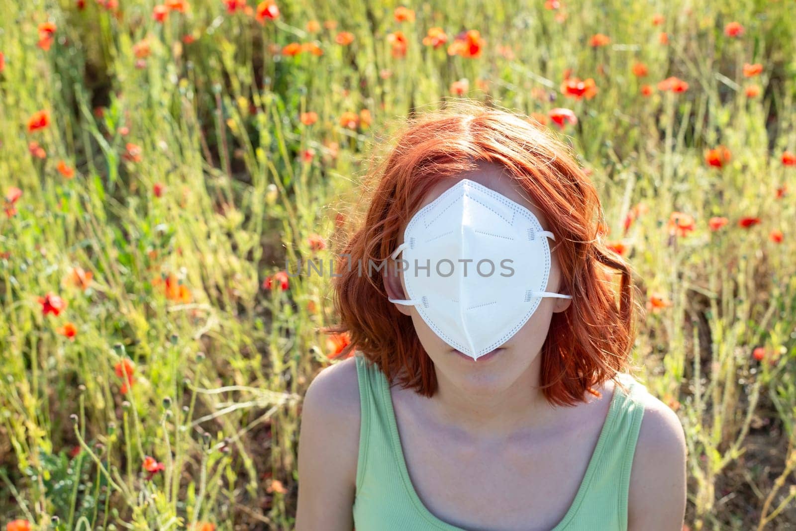 frustrated young girl with protective mask in front off face