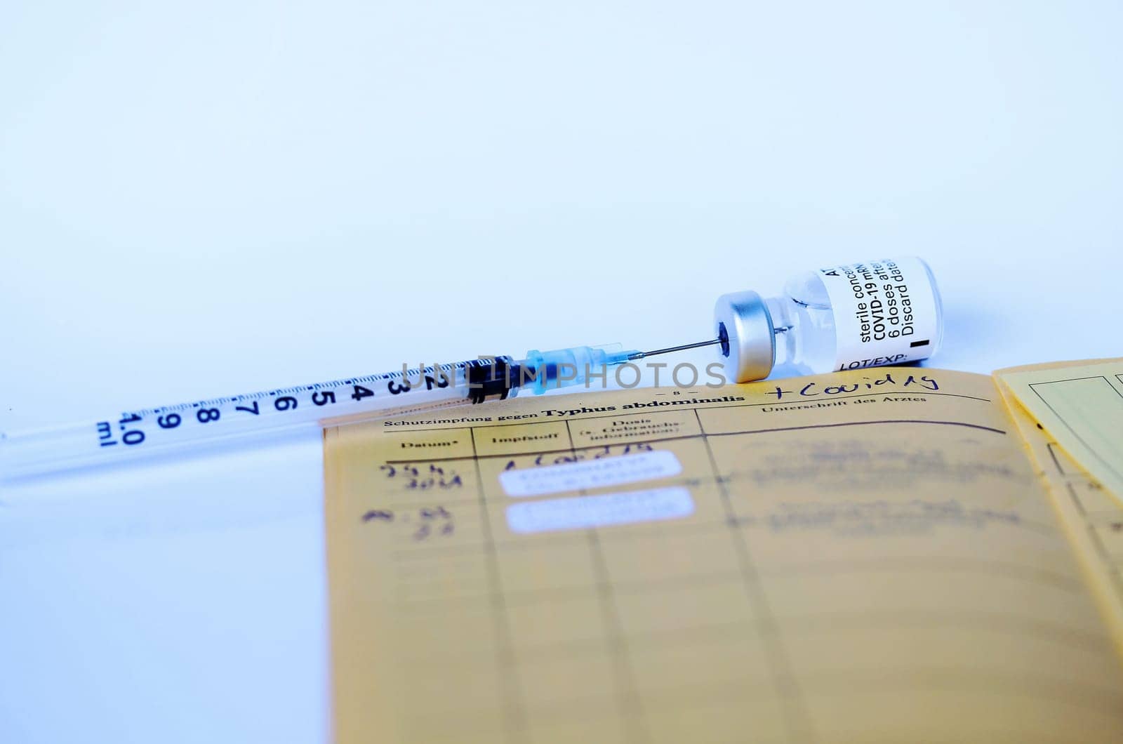 Corona Covid-19 Vaccination with Vaccination Card, Syringe and Vaccine Bottle