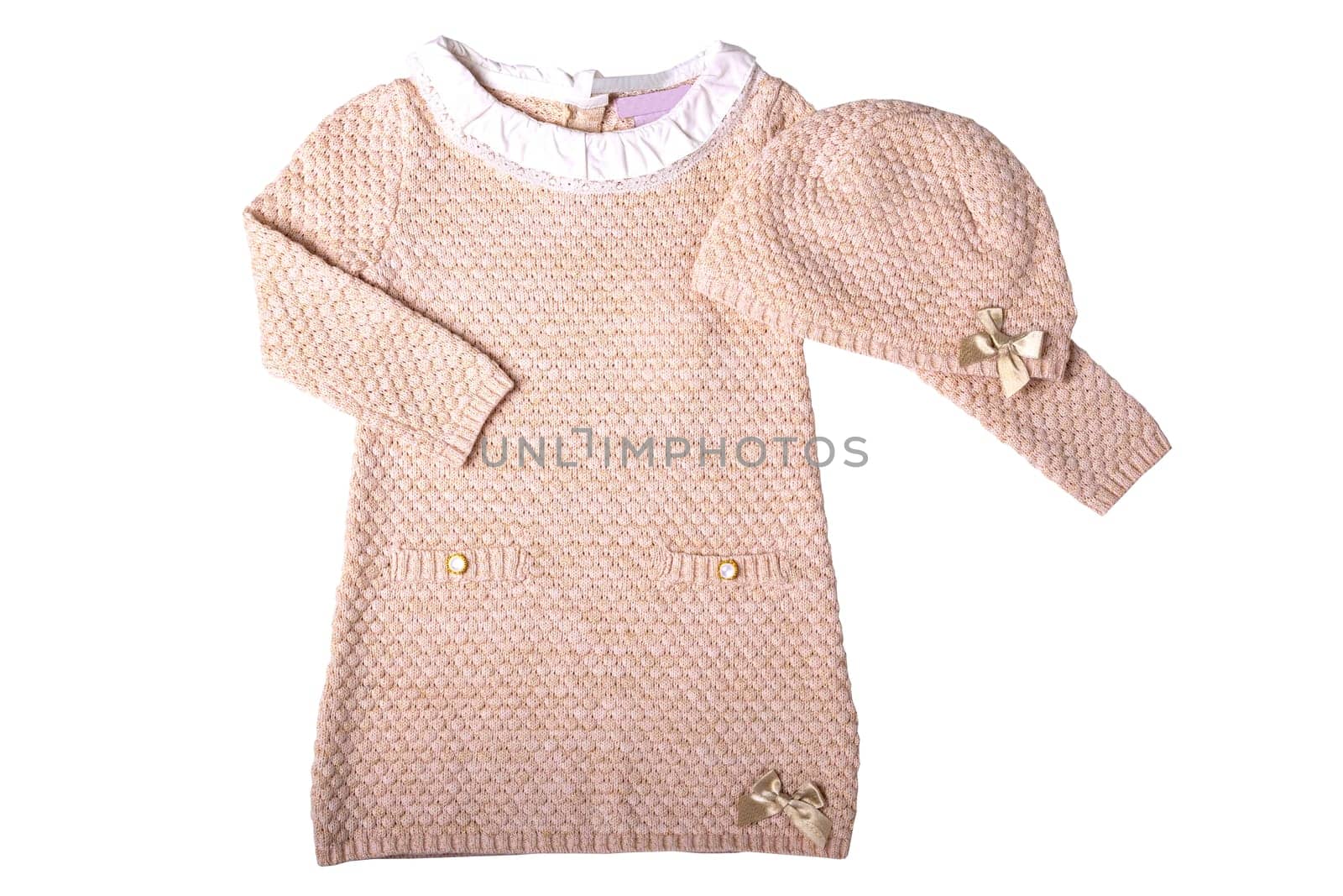 Clothes for children. A beautiful pink baby girl dress with white lace collar and matching hat isolated on a white background. Little girl autumn and spring fashion.