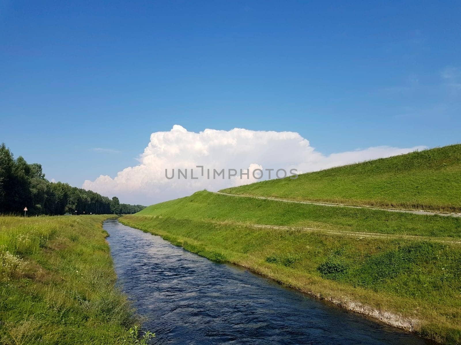 Canal near the accumulation lake of the Hydroelectric Power Plant Donja Dubrava. There are a lot of trout in it The faster and clearer channel is a place for trout fishing enthusiasts. It is 15 km long and ends in the power plant.