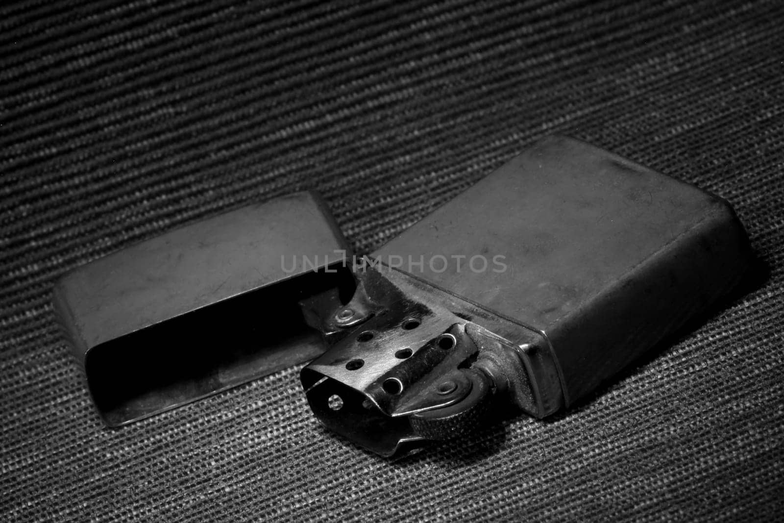 Gasoline vintage lighter close up, still life, black and white