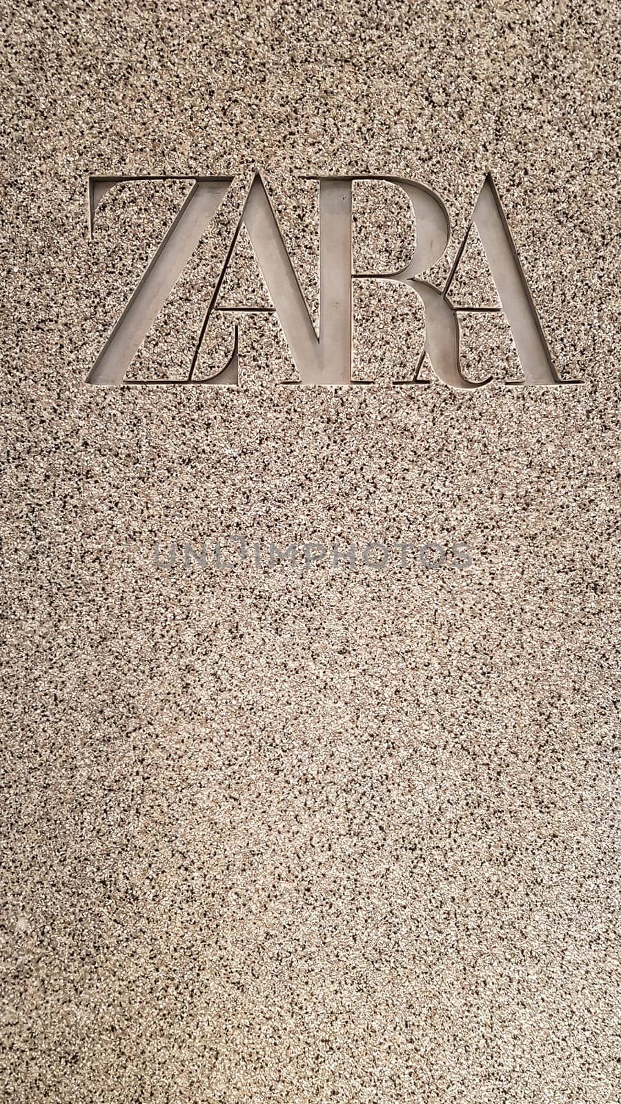 New logo for a fashion brand in a shopping center. Zara store. Spanish clothing and accessories retailer. Vertical photography as wallpaper for your phone. Ukraine, Kiev - December 2, 2021