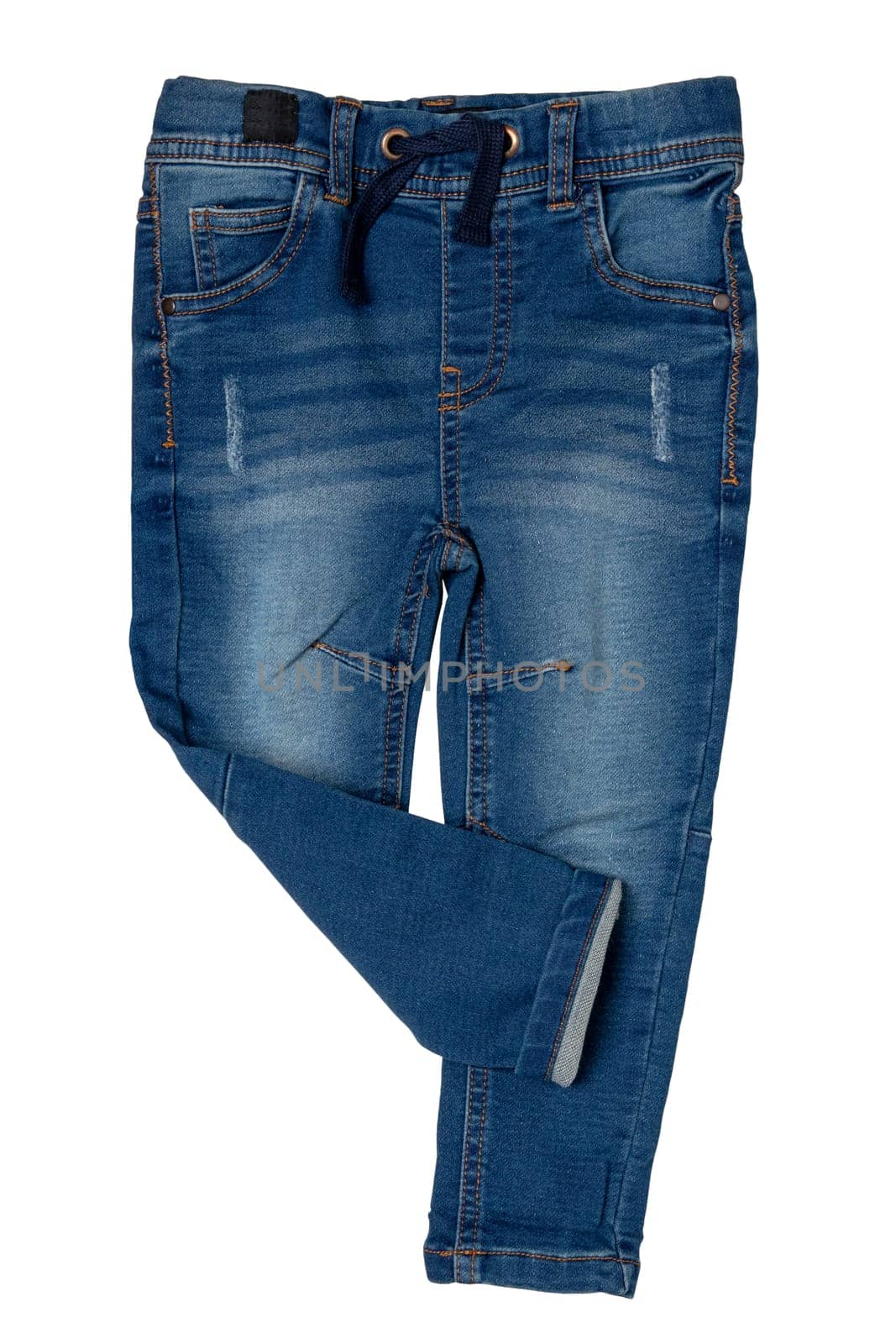 Blue jeans isolated. Closeup of a trendy stylish dark blue denim pants or trousers for boys isolated on a white background. Kids summer and autumn fashion. Front view.