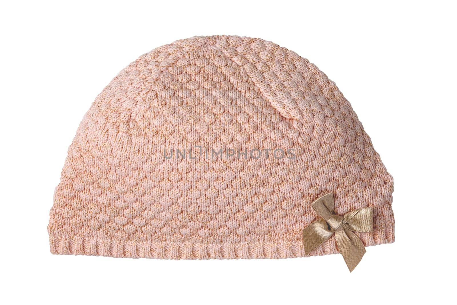 Closeup of a beautiful knitted pink wool hat or cap with a gold ribbon bow isolated on a white background. Autumn and winter fashion for children.