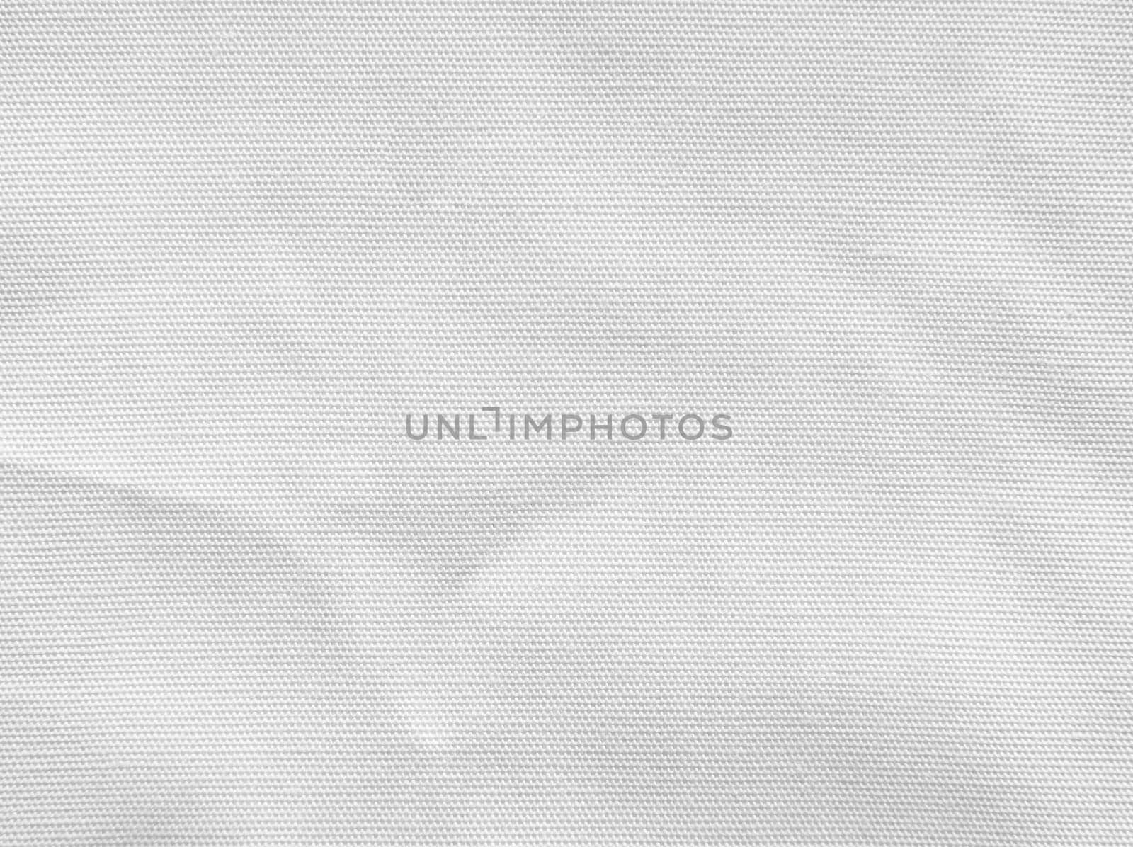 Crumpled white cotton fabric texture background