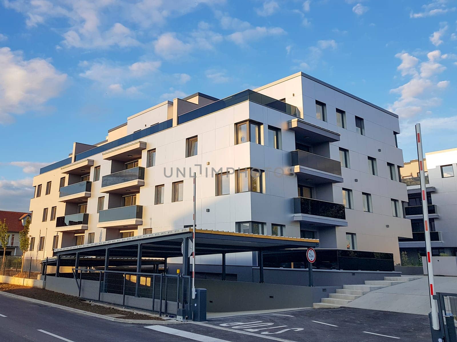 Modern gray and white residential building with four floors in Varaždin, Croatia.