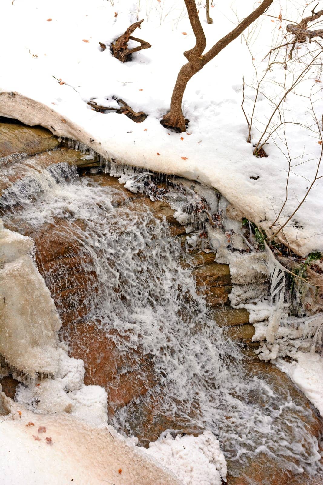 Serene Cascade Rambling Through the Snow in Starved Rock State Park in Illinois