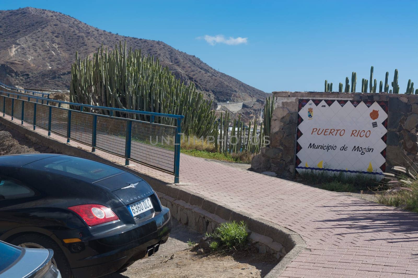 Cran Canaria, Puerto Rico, Spain - November 16, 2019:.Chrysler Crossfire Coupe in a parking lot above the marina in Puerto Rico on Gran Canaria.