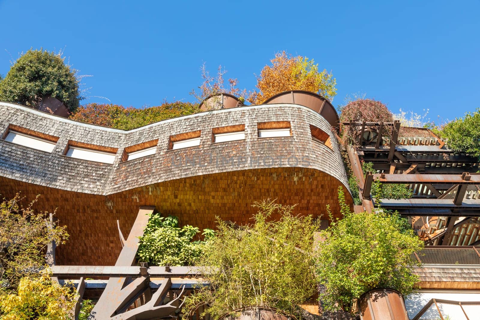 Turin, Italy - Circa November 2021: real estate green residential building. Exterior with modern design, plants and wood integrated. This Treehouse Suite is named 25 Verde